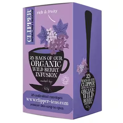 A purple box of Clipper Organic Wild Berry Infusion tea bags, featuring illustrations of purple berries and a black teacup on the front, with a spoon graphic on the side.