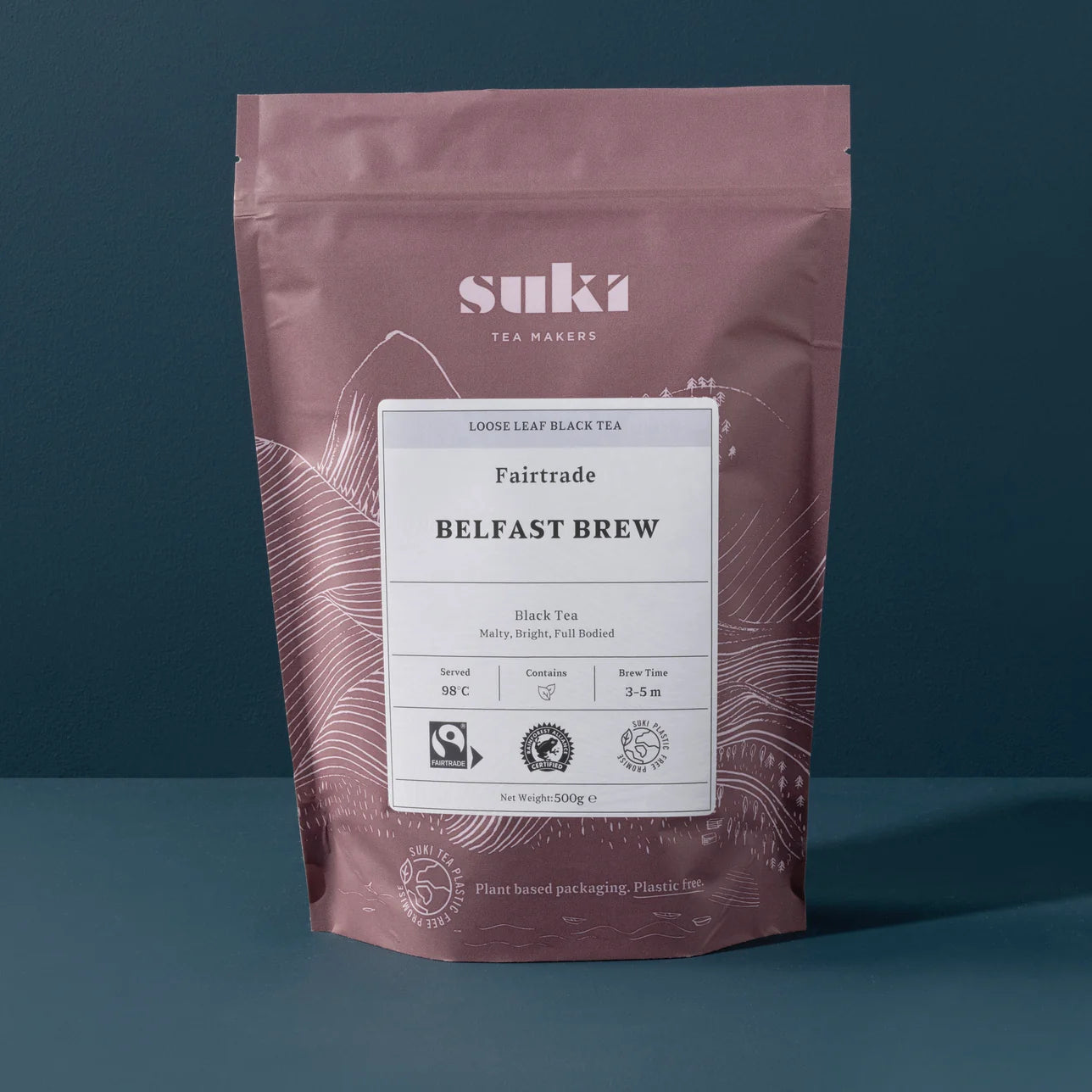 Tea package with 'suki' branding on a dark background