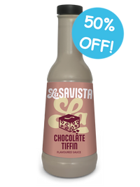 A bottle of Savista Chocolate Tiffin Flavoured Sauce on a white background with a blue '50% OFF!' promotional badge. The bottle contains a light brown sauce and has a pink label with a dark brown chocolate graphic.