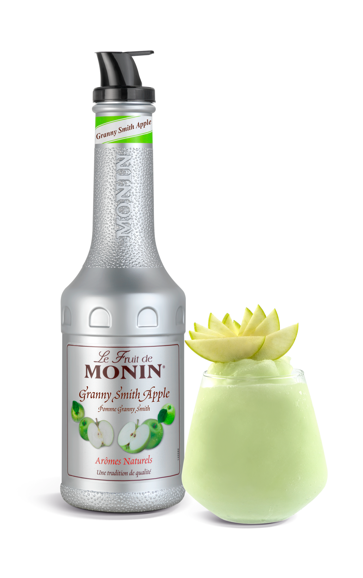 Monin Granny Smith Apple syrup bottle with a decorative apple on a white background