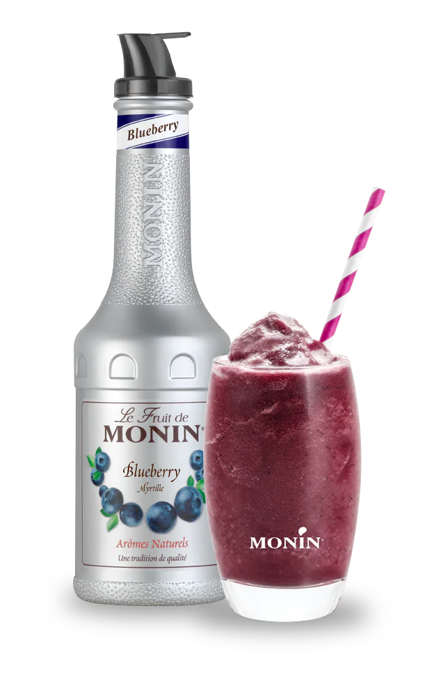 Monin blueberry syrup bottle and a blueberry smoothie on a white background