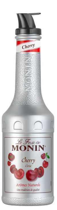 Monin Cherry syrup bottle with red label and cherries on a white background
