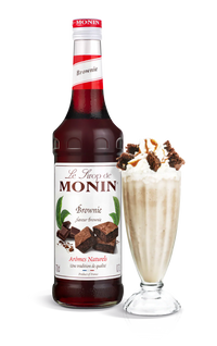 Monin Brownie syrup bottle with a milkshake on a white background