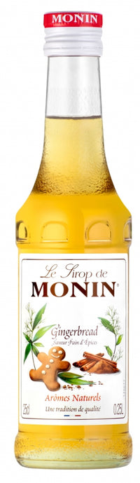 A bottle of Monin Gingerbread Syrup, 25cl, with holiday-themed packaging featuring gingerbread cookies.