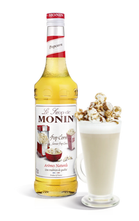 A bottle of Monin Popcorn Syrup with a graphical representation of popcorn next to it, suggesting the flavor profile of the syrup.