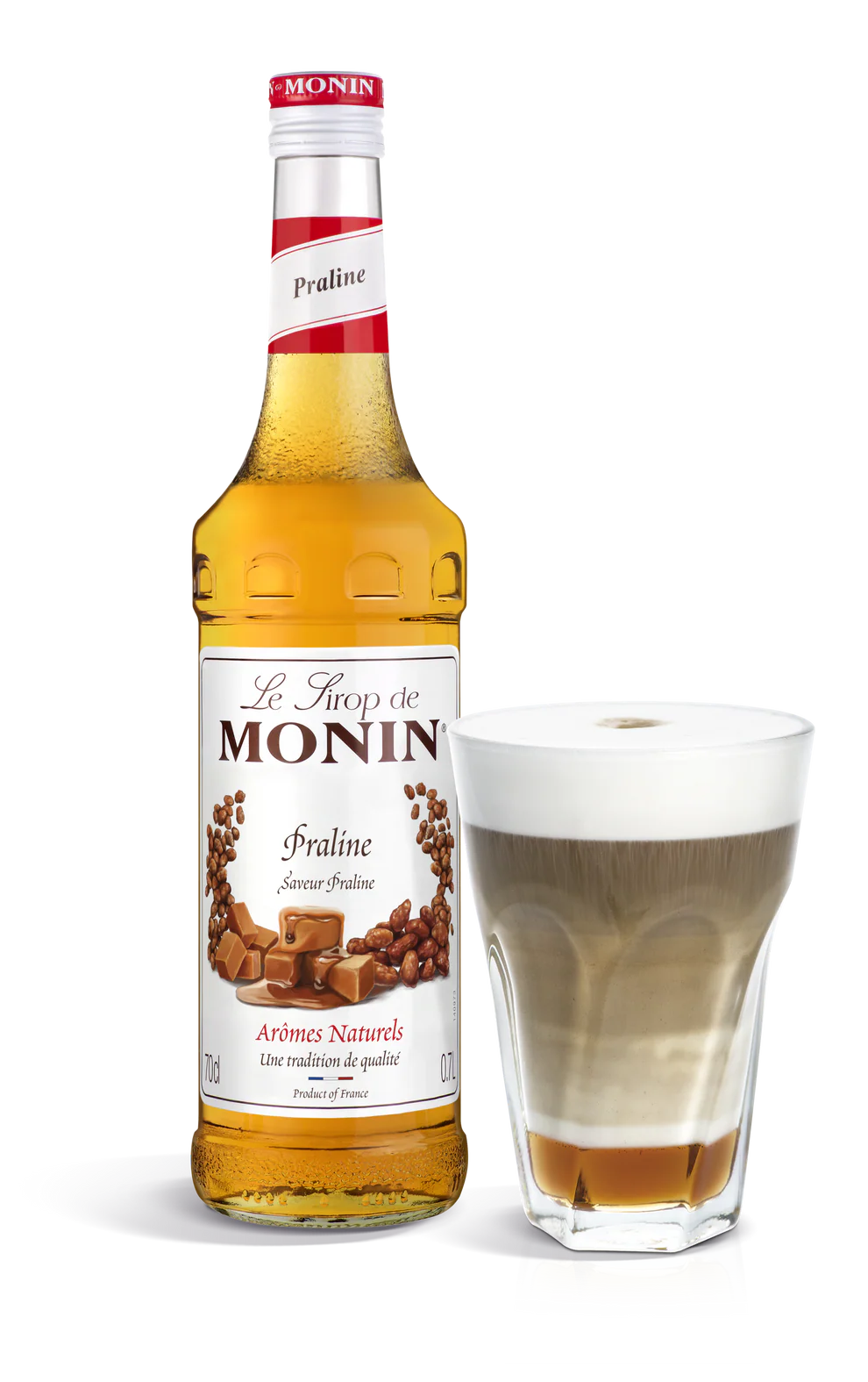 Monin Praline syrup bottle with a glass of coffee.