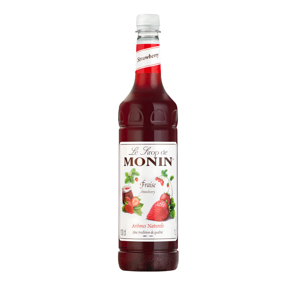 A bottle of Monin Strawberry Syrup with a label showing a picture of fresh strawberries and the name of the syrup variety.