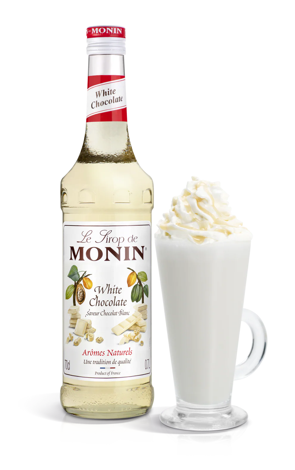 Monin white chocolate syrup bottle with a glass of white chocolate latte on a white background