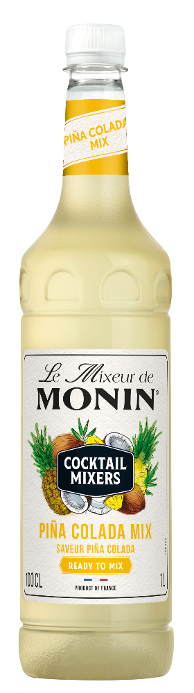 A bottle of Le Mieux de Monin Piña Colada Mix cocktail mixer, featuring a pale yellow liquid inside a clear glass bottle with a white cap and a detailed label.