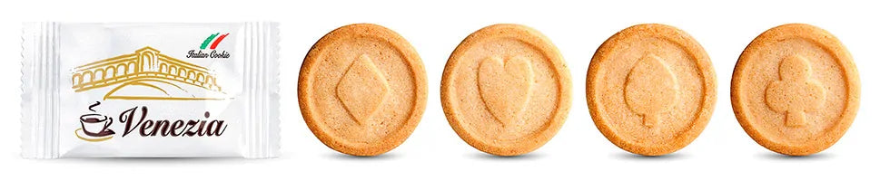 Product photograph showing Caffè Venezia branded packet alongside three embossed Italian biscuits featuring diamond, heart, and spade designs.