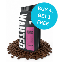 A bag of Wantum Ethiopian Djinnah whole bean coffee stands on a bed of loose coffee beans against a white background, with a bright blue circular promotional badge reading 'BUY 4, GET 1 FREE'.