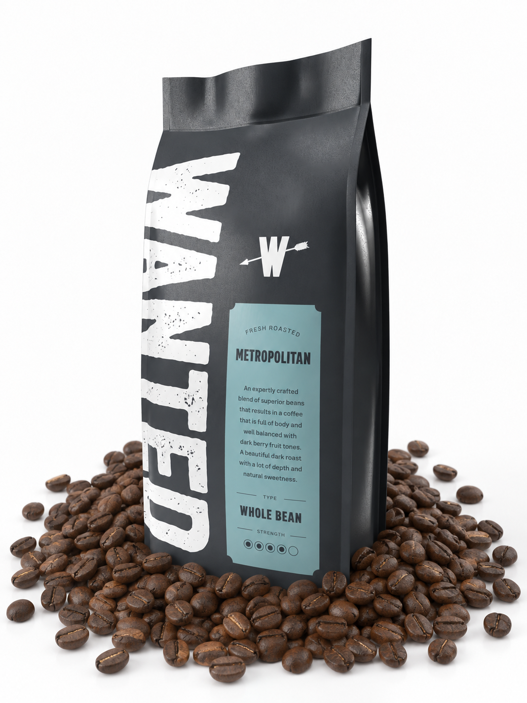 A black coffee bag with large distressed white 'WANTED' lettering and a light blue label reading 'METROPOLITAN', surrounded by scattered roasted coffee beans on a white background.