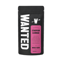 A black stand-up pouch of WANTED Ethiopian Djimmah whole bean coffee on a plain white background.