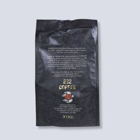 Back of the Guinness 232 Coffee Beans 227g bag with the Tiki Tonga logo and blend story