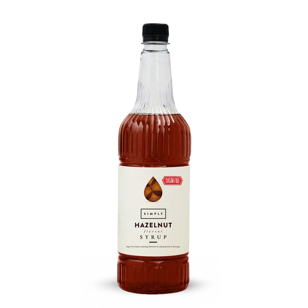 A bottle of Simply Hazelnut Infused Syrup with a cream-colored label and a black cap, shown on a clean white background.