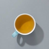 Cup of brewed Suki Peppermint caffeine-free herbal tea
