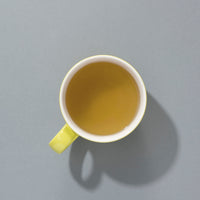 Cup of brewed Suki Organic Sencha green tea